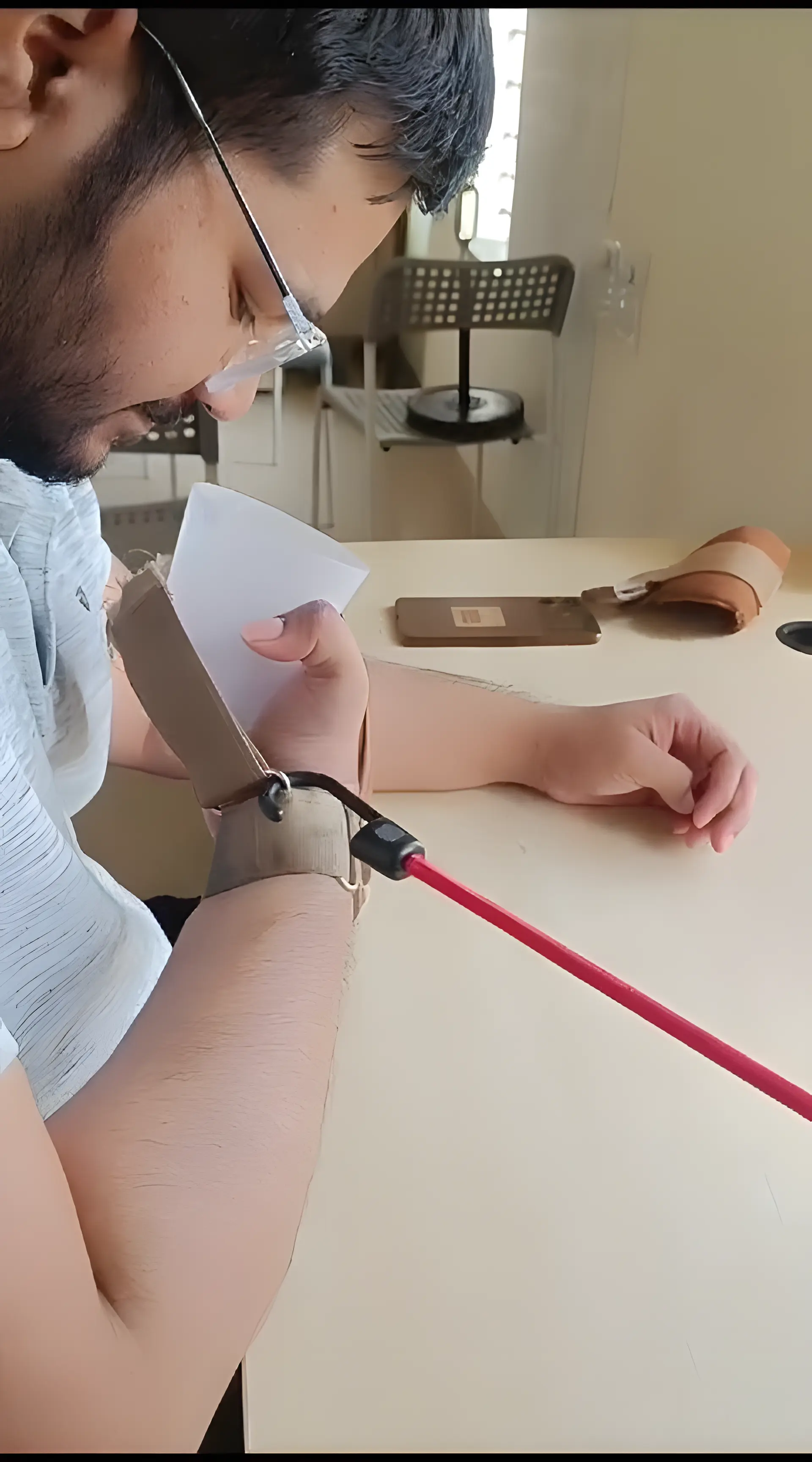 Physiotherapist assisting a Hemiplegic patient with task specific training at Regen Neuro Rehabilitation Physiotherapy Centre
