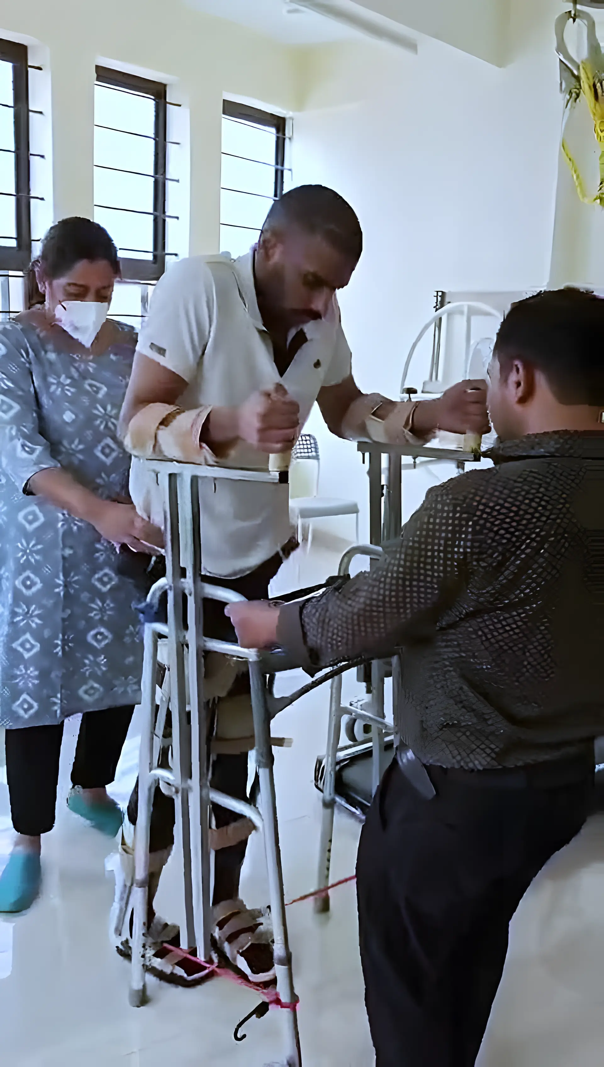 Physiotherapist assisting a Paraplegic patient with gait training at Regen Neuro Rehabilitation Physiotherapy Centre