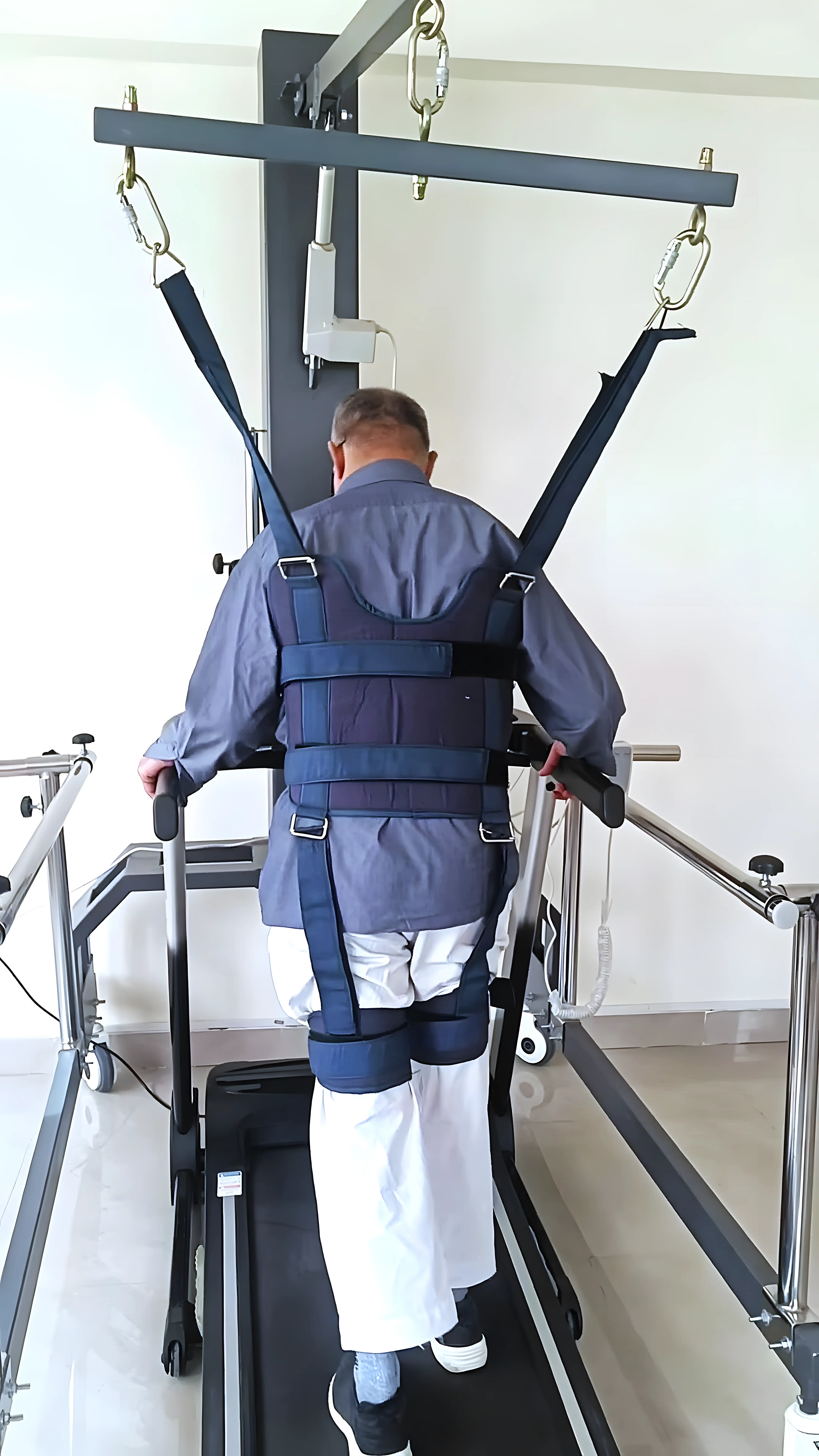 Physiotherapist assisting a patient with resisted back walking for gait training in Cerebellar disorder at Regen Neuro Rehabilitation Physiotherapy Centre