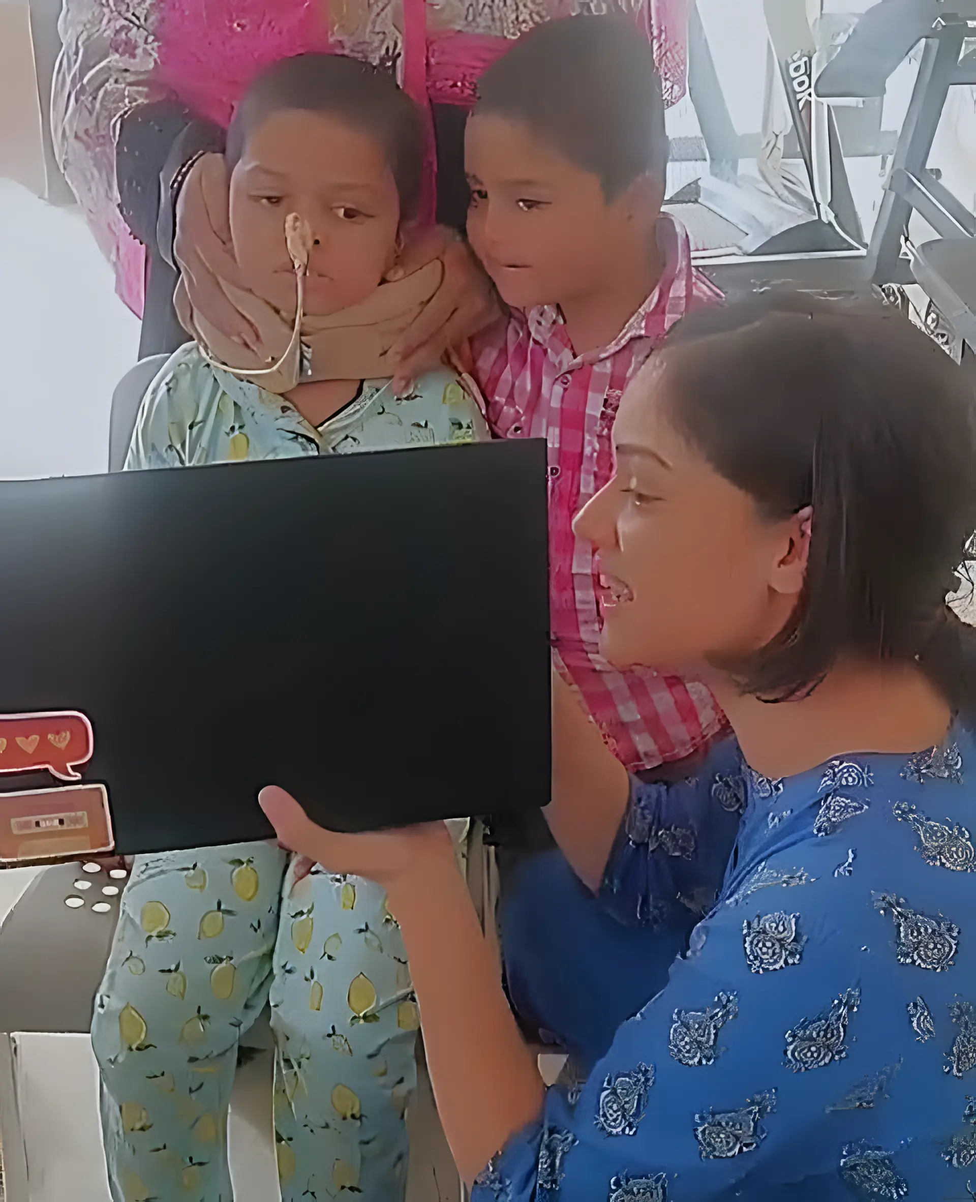 Speech therapist assisting a paediatric patient with head injury using visual cues at Regen Neuro Rehabilitation Physiotherapy Centre