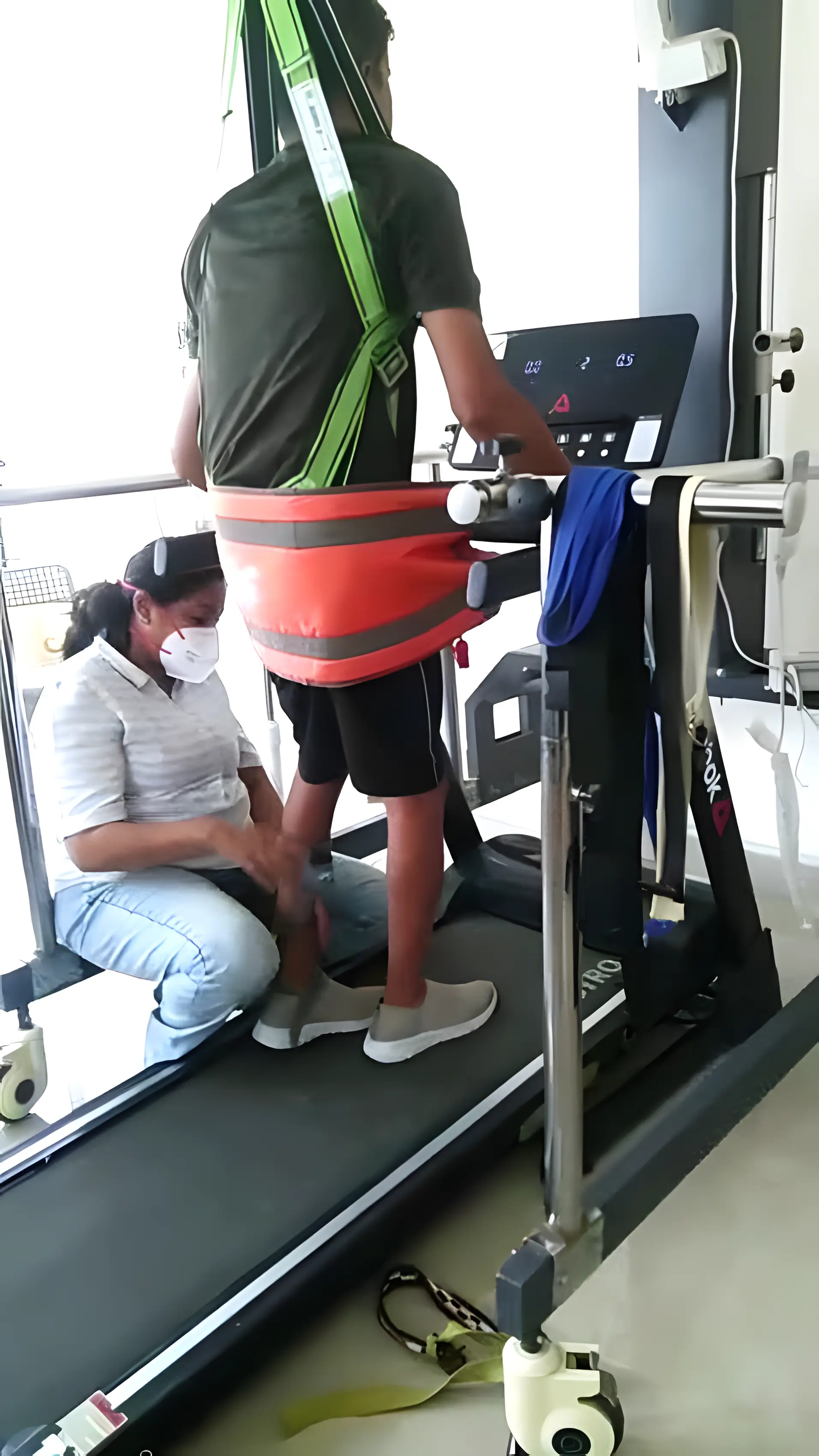 Physiotherapist assisting a Hemiplegic patient with active assisted zero gravity gait training at Regen Neuro Rehabilitation Physiotherapy Centre